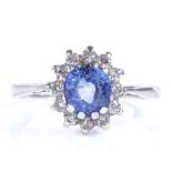 An 18ct white gold sapphire and diamond cluster ring, setting height 10.8mm, size P, 2.7g