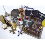 A collection of German Second War items, including medals, cloth badges etc