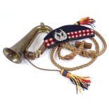 A Scottish military side cap, military bugle, and paratrooper's toggle rope (3)