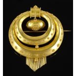 A high carat gold 2-section circle brooch, with en tremblant central orb and hanging tassels,