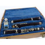 A rosewood and nickel plate 3-section flute, cased