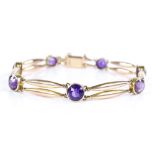 A 15ct gold amethyst set bracelet, internal diameter 62mm, 10.8g