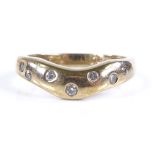 A 9ct gold 7-stone diamond wishbone band ring, setting height 6mm, size O, 4.3g