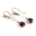 A pair of unmarked gold garnet drop earrings, height excluding fitting 26mm, 1.5g