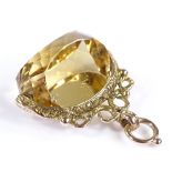 A 9ct gold faceted citrine spinning fob seal, height 31mm, 7.8g