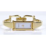 A lady's Gucci 1500L bangle wristwatch, stainless steel and gold plated case, with mother-of-pearl