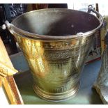 A 19th century engraved brass coal bucket with brass swing-handle, height 12"