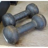 A pair of Victorian cast-iron dumbbells with impressed maker's marks, length 7.5"