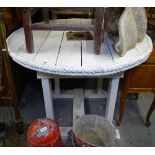 A circular white painted garden table, with rope twist edging, W105cm