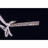 A small 9ct white gold diamond set pendant, length 20mm