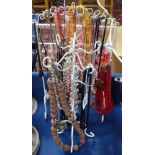 A collection of costume necklaces on 2 stands