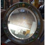 A Barbola circular toilet mirror in floral surround, 16.5" across