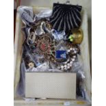 A box containing a beadwork evening bag, costume jewellery etc