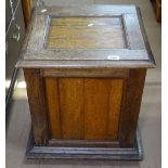 A Victorian panelled oak coal box, with rising lid, W47cm