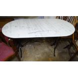 An oval white and grey marble-top garden table, on scrolled metal base, W121cm