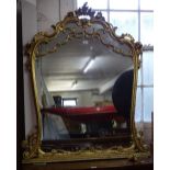 An ornate giltwood and gesso over-mantel mirror, with scrolled surround, W100cm, H120cm