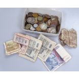 A group of coins and banknotes