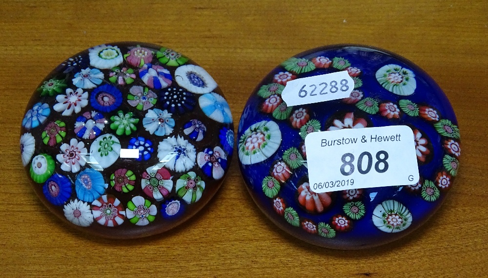 A Millefiori glass paperweight, 3" diameter, and another with cut cane floral decoration