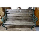 A hardwood slatted garden bench, with scrolled wrought-iron ends, L130cm