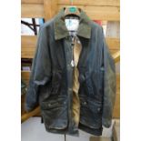 A gent's green waxed jacket, size 40