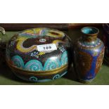 A Japanese cloisonne enamel circular box, 6" across, and an enamel vase (2)