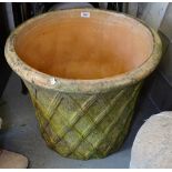 A terracotta circular planter, with lattice decoration, W60cm