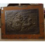 A 19th century Oriental relief embossed copper plaque, depicting a monkey god riding a chariot,