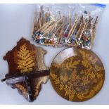 A collection of lace maker's bobbins, and a Furnware wooden folding wall rack, and a Furnware plate