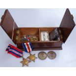 A mixed box of items, including Second War Period medals, pocket lighters etc