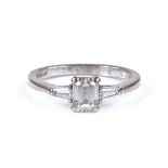 A 0.74ct emerald-cut solitaire diamond ring, with tapered baguette-cut diamond shoulders and 18ct