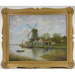 19th century Continental School, oil on canvas, windmill on a canal, indistinctly signed, 1894,