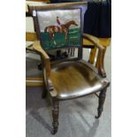 A Victorian oak desk elbow chair, with tapestry upholstered back