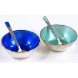 A pair of Danish sterling silver and coloured enamel salts with matching spoons, by Anton Michelsen,