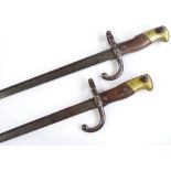 A pair of late 19th century brass-mounted sword bayonets, overall length 64cm