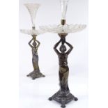 A pair of cut-glass and electroplate table centre epergnes, supported by Classical female figures,