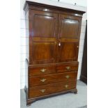 A mid-19th century flame veneer mahogany linen press, moulded panelled doors enclosing linen slides,