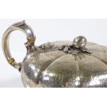 A Victorian squat silver melon teapot, of circular bulbous form, with foliate engraving and ivory