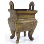 A Chinese rectangular cast-brass censer, with relief panels, height excluding handles 19cm, length