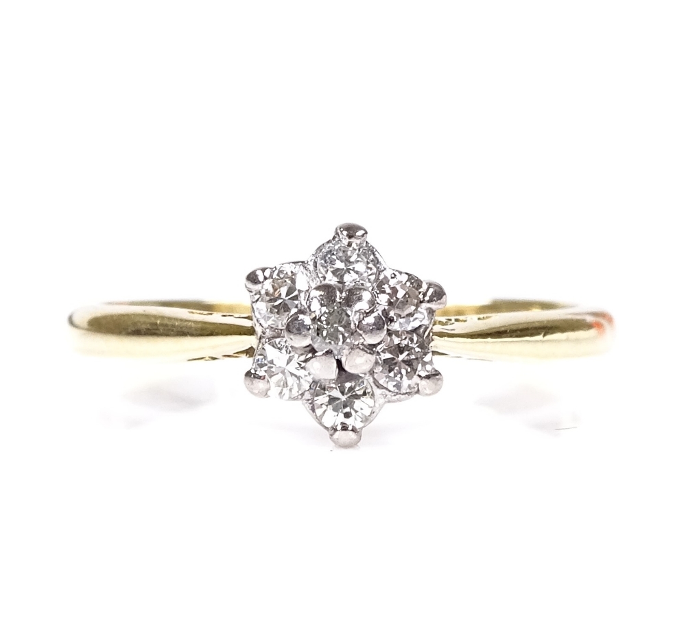 An 18ct gold diamond cluster flowerhead ring, setting height 7.6mm, size N, 2.7g