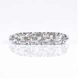 An 18ct white gold 5-stone diamond ring, pierced scrollwork bridge, setting height 4mm, size R, 2.5g