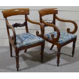 A pair of George IV mahogany elbow chairs
