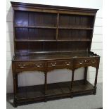 An 18th century oak dresser with boarded plate rack, 3 frieze drawers and pot board below, length 6'