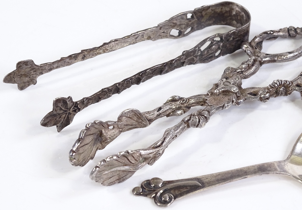 A pair of unmarked silver sugar nips, together with a pair of Swedish silver tongs, and a Danish