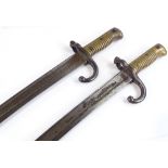 A pair of 19th century brass-hilted sword bayonets, overall length 69cm