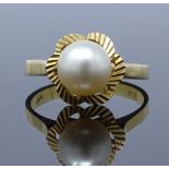 An 18ct gold whole pearl ring, pearl diameter 7.8mm, size M, 3.5g