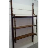 A 19th century mahogany wall hanging 3-tier open display shelf, with spindled columns, width 3'
