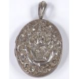 A Victorian Indian silver photo locket, with relief embossed figure riding a peacock, height