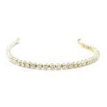An 18ct gold diamond tennis line bracelet, total diamond content over 2cts, set with 59 round
