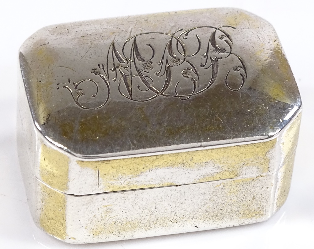 An octagonal silver vinaigrette, with floral pierced grille, by Thomas Willmore, hallmarks