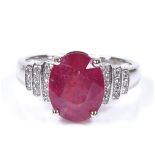 A 14ct white gold ruby and diamond cluster ring, oval-cut ruby approx 4.32ct, total diamond